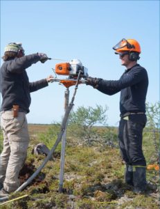 Sam Hunter and Adam Kirkwood extract a permafrost cores from a palsa in Polar Bear Park